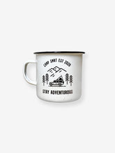 Load image into Gallery viewer, Pictured is a white enamel mug with a simple handle. In black on the front of the mug is written Camp SMRT EST 2020 on top and Stay Adventurous on the bottom. In between is a drawing - still in black - of 3 overlapping mountains over 4 simple pine trees and a Land Rover Defender 110 SUV with a SMRT Tent hard shell roof top tent on the roof rack. Great to enjoy in your roof top tent! Available for sale by SMRT Tent in Denver, Colorado, USA.

