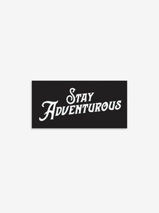 Pictured is a black rectangular sticker with the words Stay Adventurous in white. Perfect to show your passion for outdoor roof top tent camping! Available for sale by SMRT Tent in Denver, Colorado, USA.